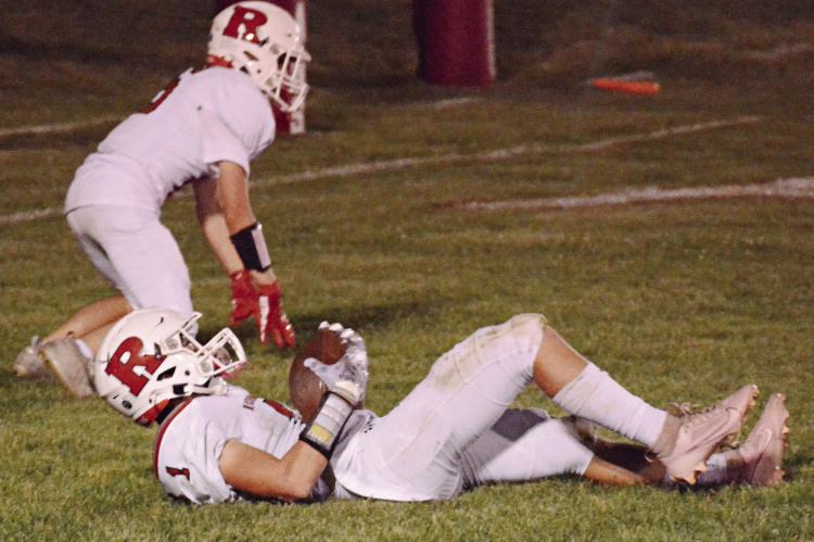 WITH TEAMMATE Logan Moyer behind him, Richmond first-year high schooler Dryden Hendrix lies in the end zone after making a second-quarter, touchdown-saving interception during the Spartans’ Sept. 29 victory at Carrollton. SHAWN RONEY | Staff