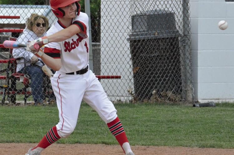 AT TIMES, some intense “arguing” with a camera is required to make it functional enough to capture the drama of high school baseball and other sports. SHAWN RONEY | Staff