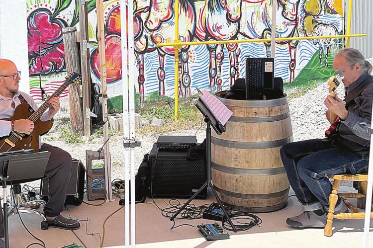 ALAN VOSS AND FORREST STEWART play jazz music for Of The Earth Farm Distillery’s Sunday Soiree. SOPHIA BALES | Staff