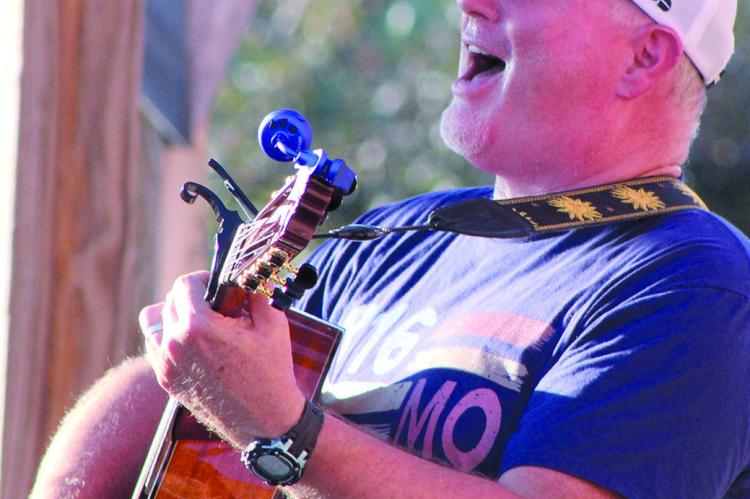 SHARON DONAT | Staff PASTOR PAUL GRANT sings to the crowd during the 816 Music Celebration.