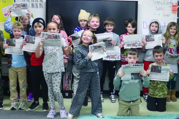 STUDENTS AT HARDIN-CENTRAL Schools share the North Pole News, marking more than a decade of collaboration between high school writers and elementary classrooms. KELSEY NOLKER | Submitted
