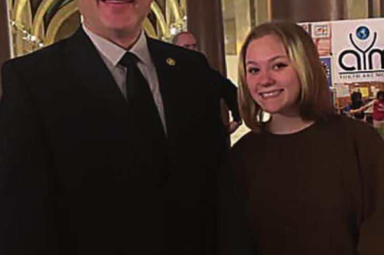 ORRICK School District eighth-grader Destiny Rohde creates a piece of art that state Sen. Denny Hoskins chooses to represent the 21st Senatorial District in the 2022 Senate Student Arts Exhibition. With Hoskins, left, she appears at the Capitol in Jefferson City. At right, she shows her painting hanging in the Capitol building.