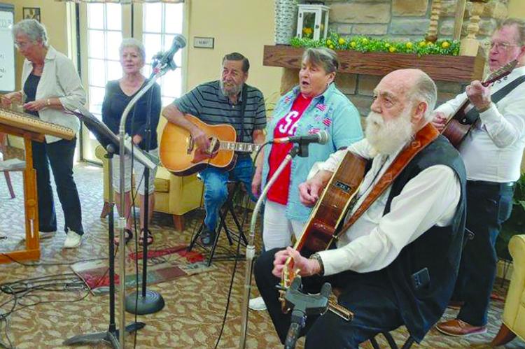 IVA DEHN, (from left), Mary Eddings, Walter Wiegand, Mary Kelton, David Simmons and Gene Suddarth finish the performance with “Amazing Grace”. DAVE DONALDSON | Staff