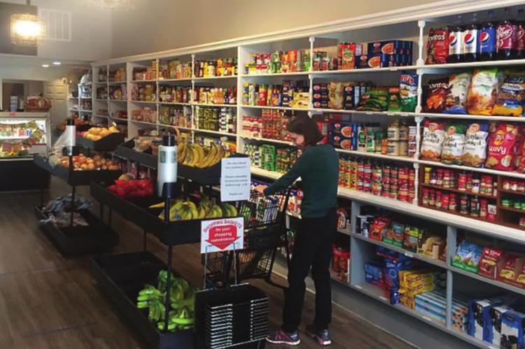 RUN BY John Paul Coonrod, Great Scott Community Market fits inside an old shoe store. DANA CRONIN | Harvest Public Media