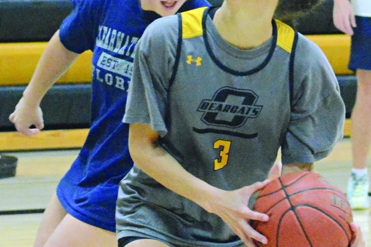 ORRICK SENIORS Izzy Wheeler (left) and Anela Fletcher practice dribbling and shooting. SHAWN RONEY | Staff
