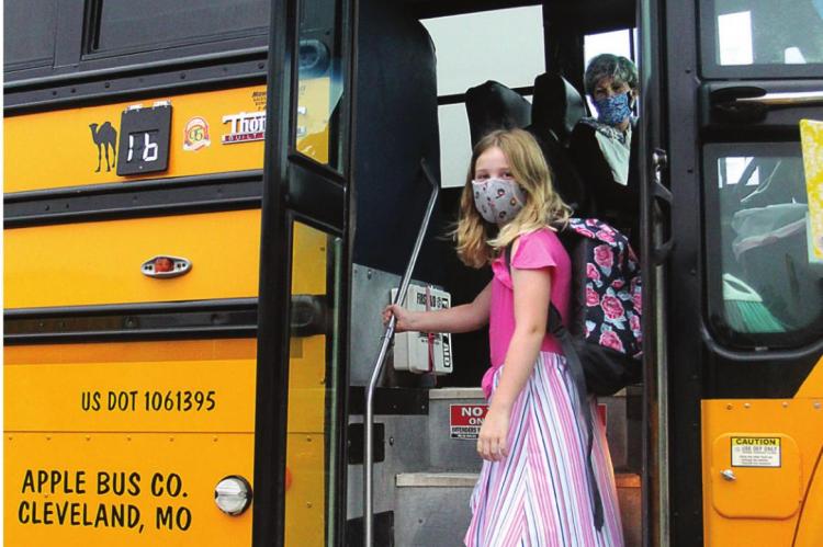 J.C. VENTIMIGLIA | Staff STUDENT Averie Goetz, 8, rides on a bus that has been safety inspected by the Missouri Highway Patrol.