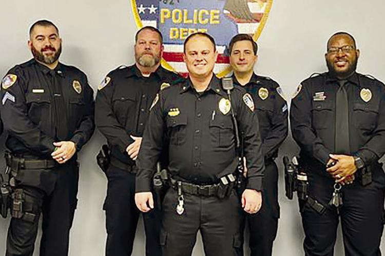 SEVERAL RICHMOND POLICE OFFICERS received awards and promotions during a recent Richmond City Council meeting. Detective Aaron Adkins, Cpl. Tomas Rodriguez, Lt. Brandon Ray, Interim Chief Scott Bagley, Sgt. Luke Covey, School Resource Officer Romulus Davis and Cpl. Cody Davis are seen here getting together and celebrating their promotions. SOPHIA BALES | Staff