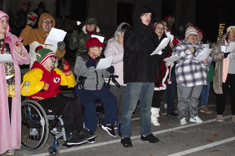THE SNS CHOIR performs a variety of classic Christmas Carols before the lighted Christmas Parade. SHARON DONAT | Staff