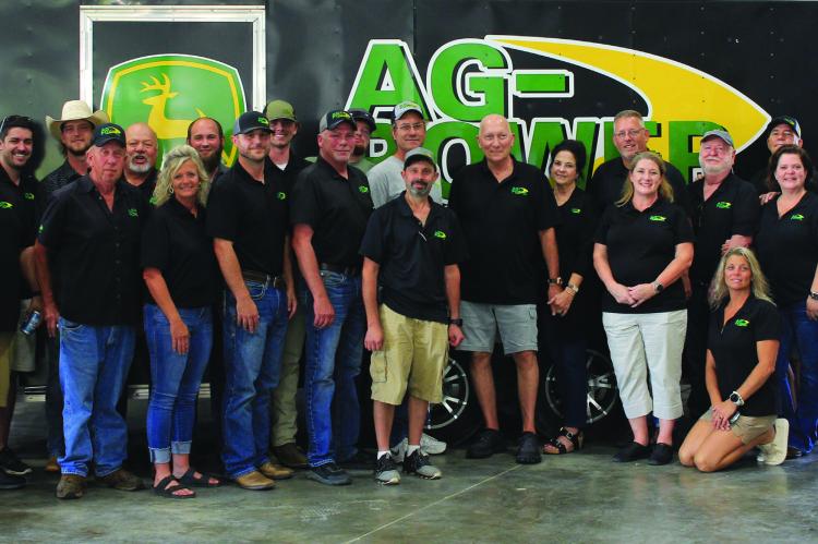 Ag-Power’s staff gather to show off their new facility and to celebrate its grand opening Aug. 26. The evening includes live music, food and drink, drawing guests from across several counties. SOPHIA BALES | Staff