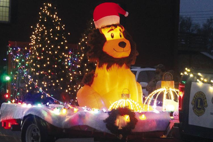THE FESTIVE Orrick Lions Club float delights children along the parade route. SHARON DONAT | Staff
