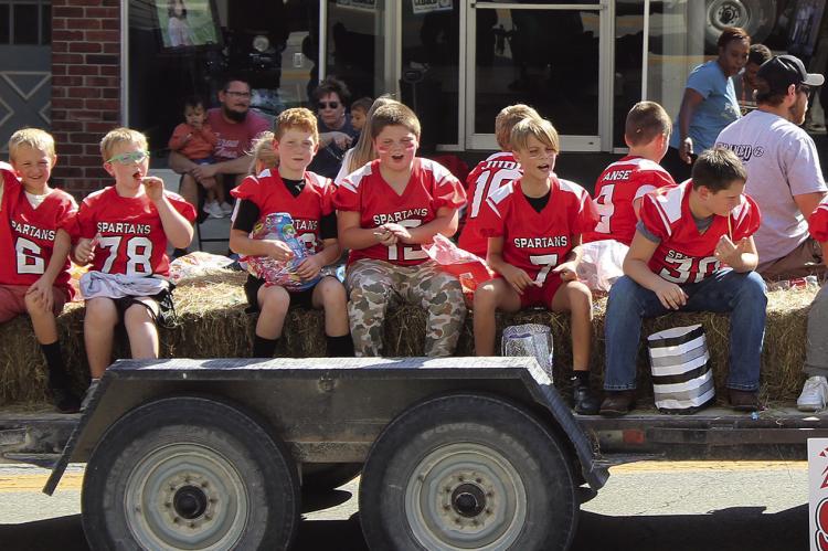 THIRD GRADE SPARTAN football players enjoy taking part in the parade. SHARON DONAT | Staff