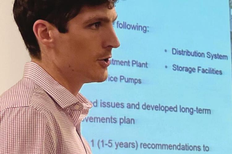 TAYLOR JERGENS, representing Olsson, shares a summary of water leaks with council members. BRIAN RICE | Staff