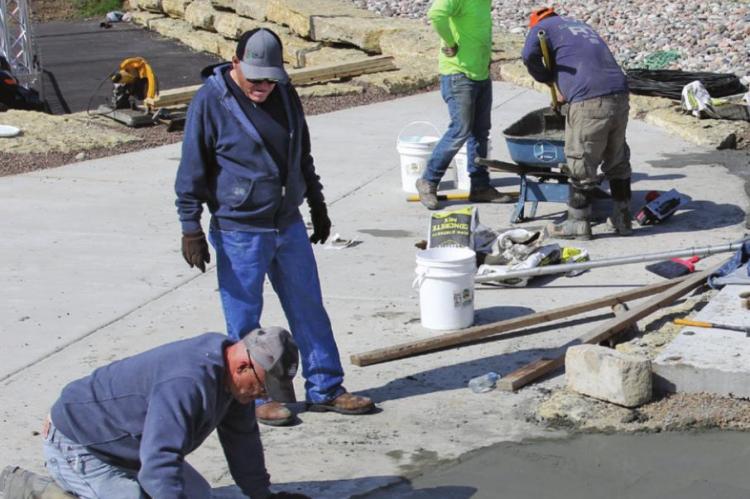 THE BRANDED STEAKHOUSE Outdoor Theater is nearly complete as J.P. Wright smooths concrete that comprises the stage. A covering will go over the top. At the side of the stage is a water feature. J.C. VENTIMIGLIA | Staff