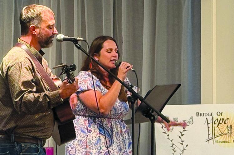 DREW AND KATIE GILL perform during the annual fundraising Bridge of Hope Gala. The event supports the non-profit’s mission to meet the needs of those facing the challenges of raising a family. DARROLL RUARK | Submitted