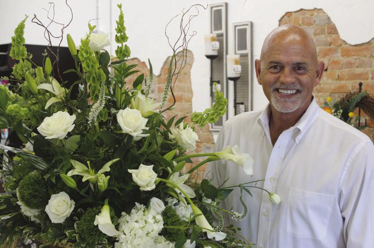 RANDY WRISINGER at the grand opening of his new floral shop on the Richmond square, RNR Designs. SHARON DONAT | Staff