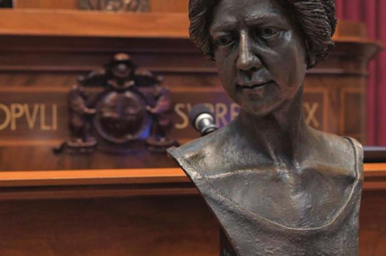 THIS BRONZE BUST of Annie White Baxter, the nation’s and Missouri’s first female county clerk, is viewed in the House chamber. The bust has since been placed on display in the Capitol Rotunda’s Hall of Famous Missourians. TIM BROMMEL | House Communications