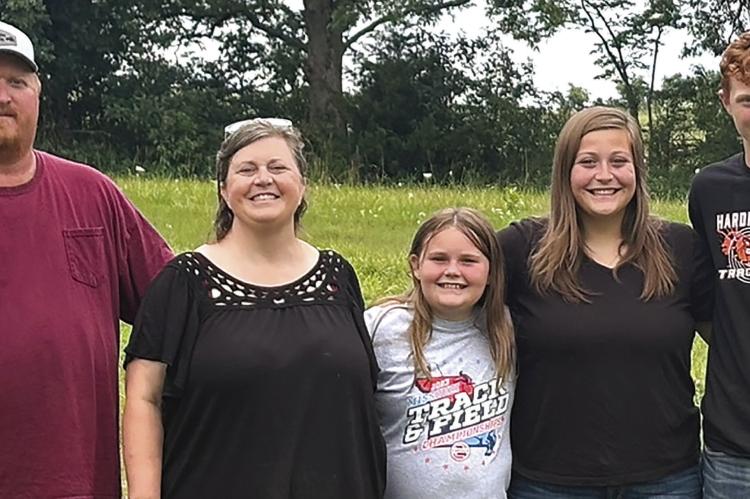 Jeremy McGinnis (from left), his wife Jamie McGinnis, daughter Amaryllis, daughter Kassie, and son Kaden are this year’s recipients of the Ray County Farm family. JOSHUA BRUNGARDT | Staff