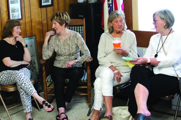 NANCY GILBERT (from left) chats with Patti Bamman, Janet Annette and Valerie Miller at the Chamber After Hours.