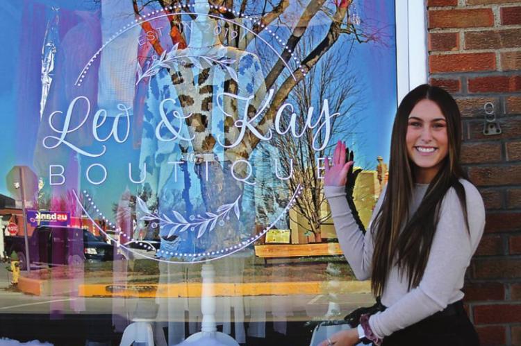 OWNER Peyton Bowman, 19, shows off the window to her boutique, Leo and Kay, which opens Dec. 11 at 103 W. Main St., Richmond, across from the Ray County Courthouse. J.C. VENTIMIGLIA | Staff