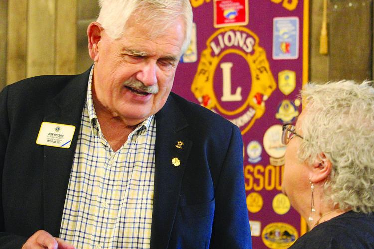 PREVIOUS LIONS CLUB International Director Don Noland (left) visits with other club members from across the state during the 75th anniversary celebration. MIRANDA JAMISON | Staff