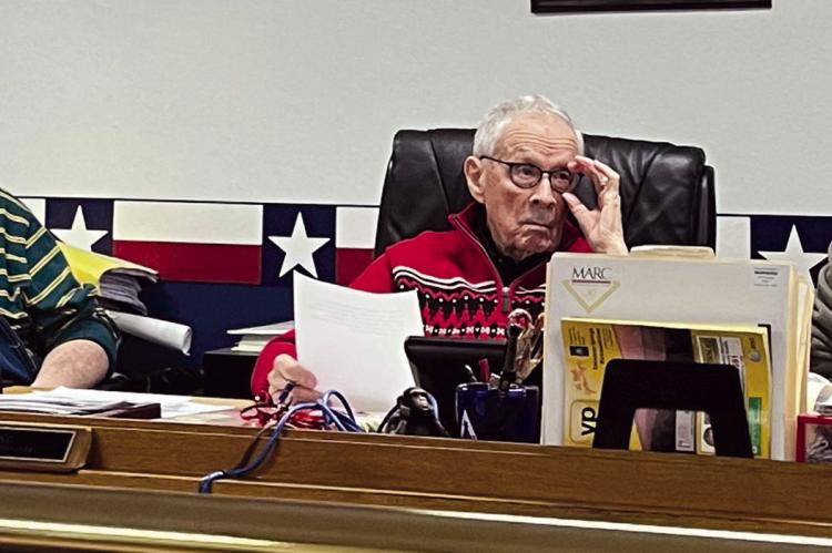 GARY WILHITE (from left), BOB KING and Dave Powell listen in as Pastor Willie Isaacson presents his ideas to the Ray County Commissioners. The pastor asks for requests and statements pertaining to Amendment 3 and the potential of microbusinesses opening in Ray County. SOPHIA BALES | Staff