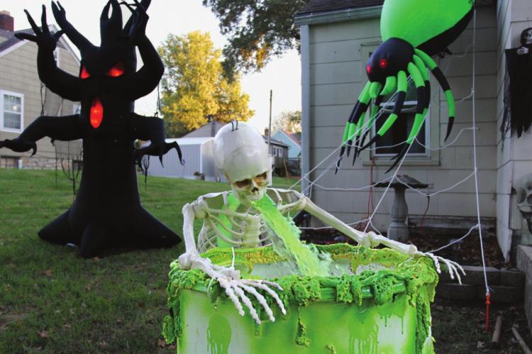 AT 707 AND 705 E. Lexington St., Richmond, this skeleton must have bellowed to a frat boy or sorority girl in life, because in death there is a constant stream of green ookiness pouring from his mouth. J.C. VENTIMIGLIA | Staff
