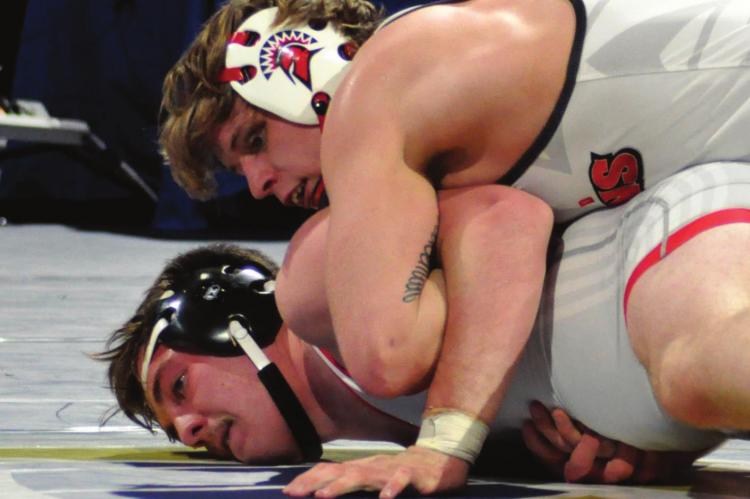 SENIOR RYKER PLYMELL, working from the top position against Maysville’s Blayke Kolb, takes third place in the 195-pound division.