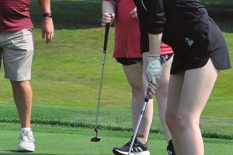 RICHMOND SENIOR and returning Class 1 state qualifier Tori Bowman attempts a long putt during the first day of girls golf practice at Shirkey Golf Course in Richmond. SHAWN RONEY | Staff