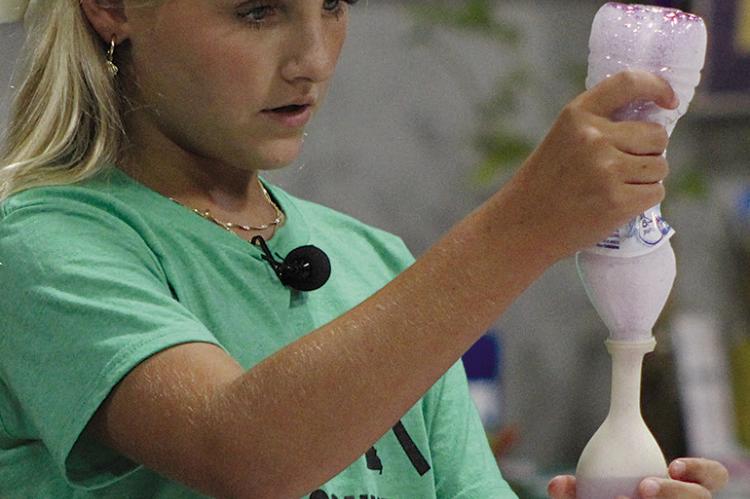 KINSLER HULSEY demonstrates making a glitter stress ball. SHARON DONAT | Staff