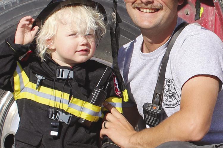 LIAM JOHNSON (left) dresses like his uncle, Wood Heights firefighter Kody Gaines. SHARON DONAT | Staff