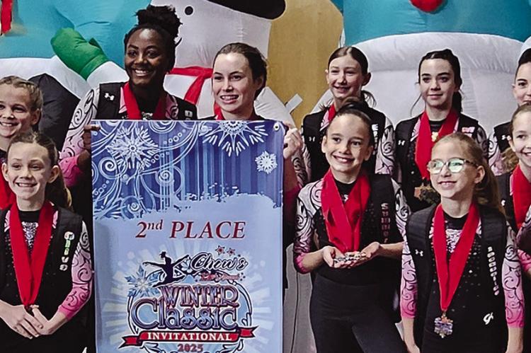 THE NORTHWEST GYMNASTICS Excel Gold Team secures second place overall at the recent Chows Winter Classic competition in Des Moines, Iowa. The team members include Mila Persell (front row, from left), Olive Behler, Summer Lawson, Jacqueline Wood, Mikierah Sunderland, Brooklyn Davis, Addie Effenheim and Brooklyn Braune. Back row: Gabi Hopper, Rylee Pensick, Haisley Taylor, Dalia Hopper, Sarah Howerton, Ellie Evans, Madi Ray and Brooklyn Pahlar. Submitted