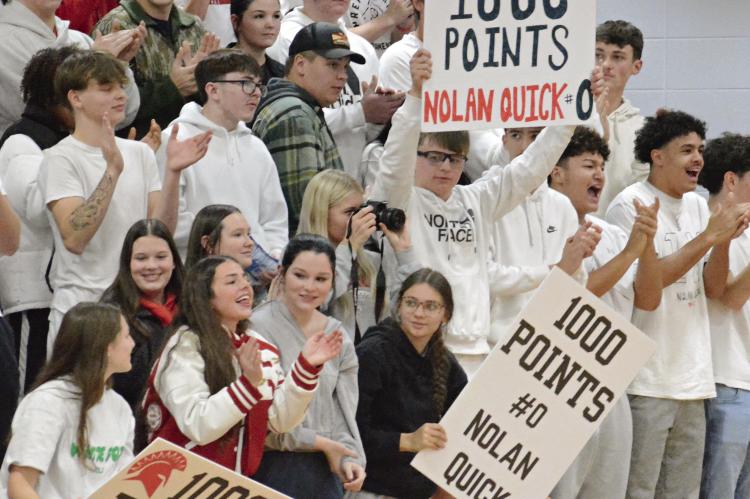 RICHMOND’S STUDENT SECTION cheers when senior Nolan Quick scores his 1,000th career point in varsity basketball, achieved during the first half of the Spartans’ meeting with Winnetonka. SHAWN RONEY | Staff