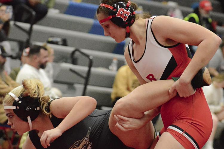 MAKYNLEI CRAIG of Excelsior Springs (left) tries to escape the clutches of Richmond sophomore Taylor Baker at the Drew Emerson Invitational. SHAWN RONEY | Staff