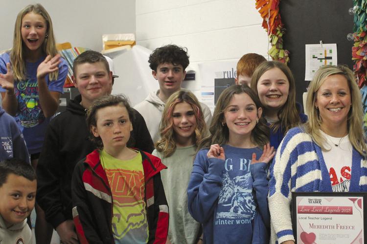 MEREDITH FREECE (with award) celebrates winning the Local Legend Best Teacher award with her class at Hardin Central. SHARON DONAT | Staff