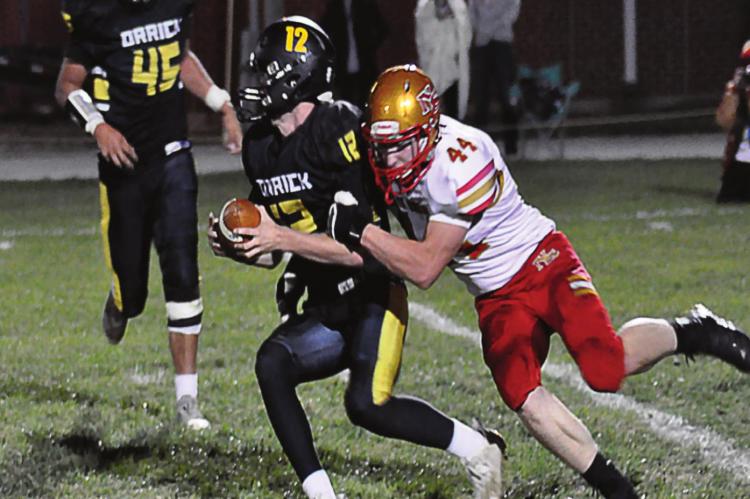 ORRICK QUARTERBACK Blake Buchanan tries to break free from Luke Schwanke’s grasp Oct. 16 at Simmons Field. SHAWN RONEY | Staff