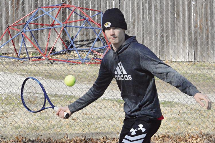 JUNIOR GABE BAKER practices his baseline forehand return shot March 14 at Maurice Roberts Park in Richmond. SHAWN RONEY | Staff