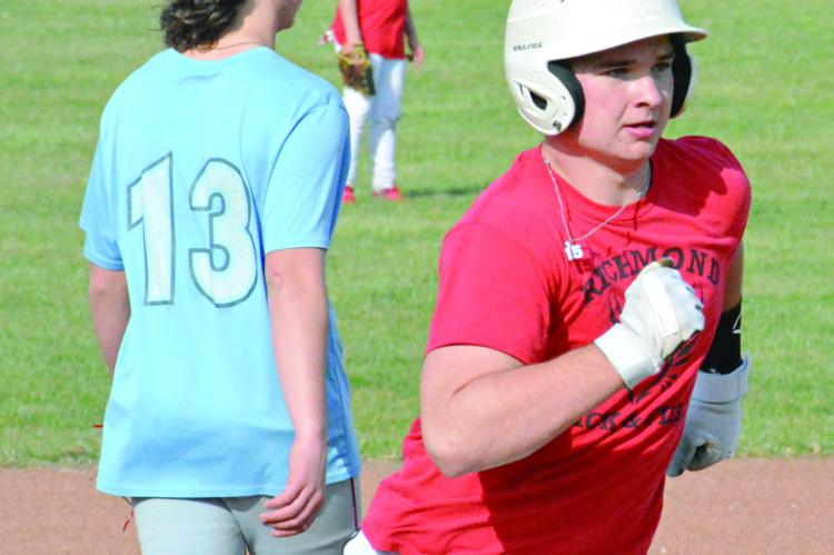 SPORTING A white batting helmet, Richmond first-year high schooler Jacob Lieberknecht rounds third base during a March 12 practice at Southview Park. SHAWN RONEY | Staff