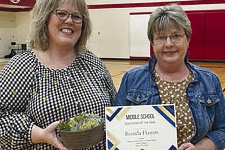 President of the Missouri State Teachers Association Michelle Krog (left) awards Richmond Middle School teacher Brenda Hamm the Educator of the Year Award. | Submiitted