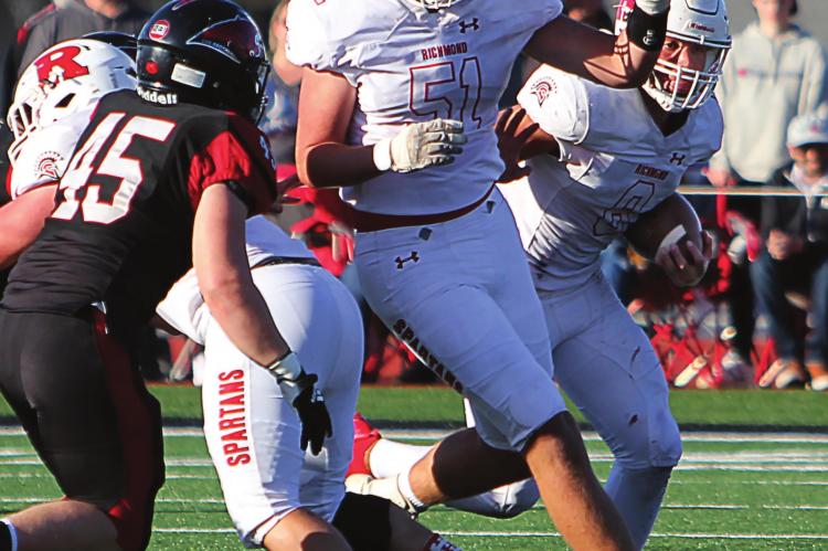 WITH JUNIOR LINEMAN Jack Gogue in front of him, Richmond senior quarterback Keyshaun Elliott seeks running room against the Lamar Tigers. J.C. VENTIMIGLIA | Staff