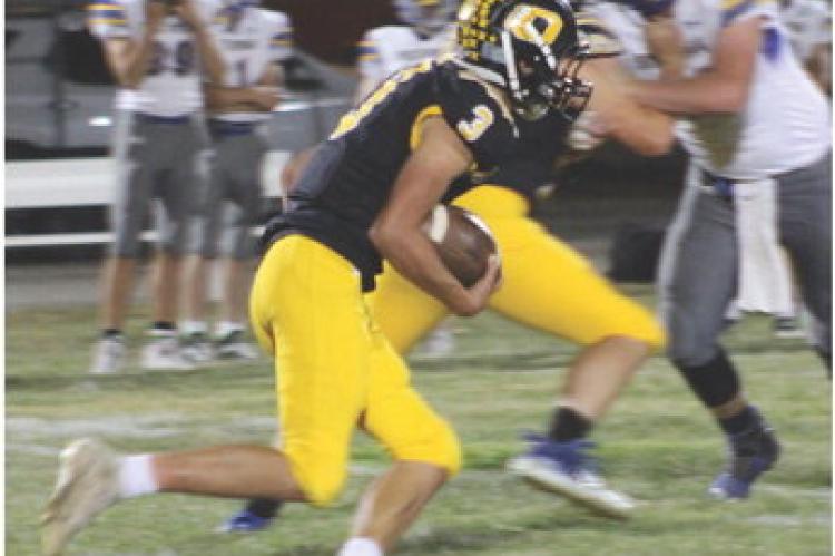 CALLED ON to do the lion’s share of the running after Jaxon Miller suffers a minor hamstring pull, Orrick senior Zander Stevinson carries the football during the Bearcats’ Sept. 30 homecoming victory. SOPHIA BALES | Staff