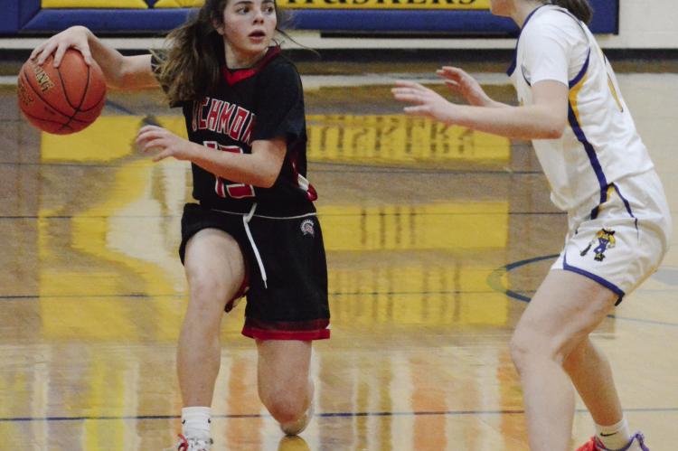 GENEVIEVE DIDIER (left), shown in December 2022, looks to be a team manager in multiple sports this school year while she rehabs from an injury. SHAWN RONEY | Staff