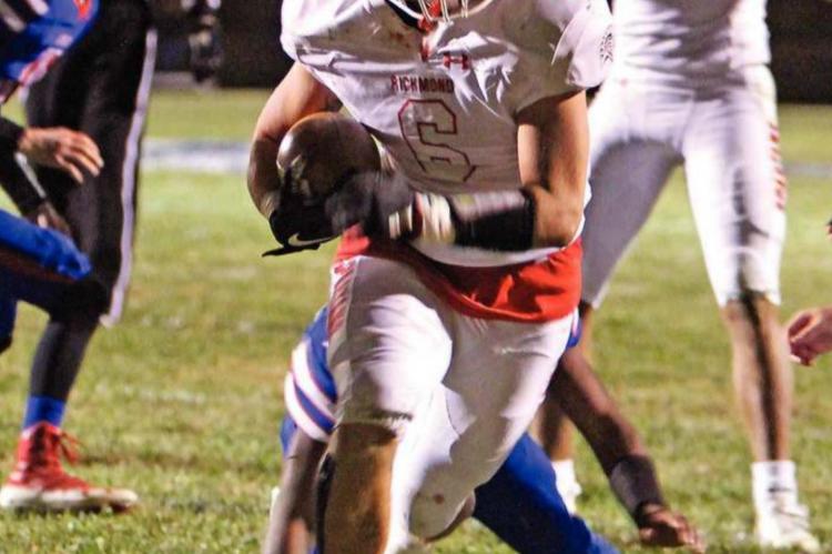 RICHMOND begins the first drive of the third quarter tied at 16 with Lexington. Quarterback Keyshaun Elliott pounds the ball forward on the ground for the Spartans. Then, from the 6, senior fullback Wyatt Marshall gets the call and carries the ball across the goal line for the winning score. He adds two points on the conversion to put Richmond ahead for good, 24- 16, in the MRVC East championship showdown against Lexington. J.C. VENTIMIGLIA | Staff