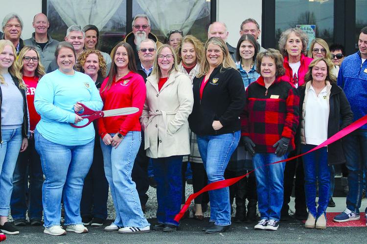 CHAMBER AND COMMUNITY members take part in a ribbon-cutting recognizing the opening of Goppert Bank in Richmond. SHARON DONAT | Staff