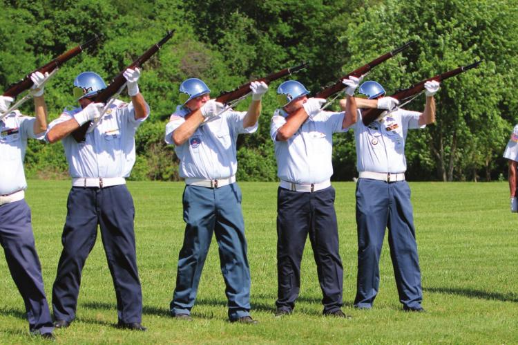 LEST WE FORGET IN MEMORY of veterans who have died, the Veterans Honor Team fires a salute. From left are Jim Richardson, Homer Lollard, Jack Orr, Royce Brock, Bill Cain and, giving the command, Jim Bowman. J.C. VENTIMIGLIA | Staff