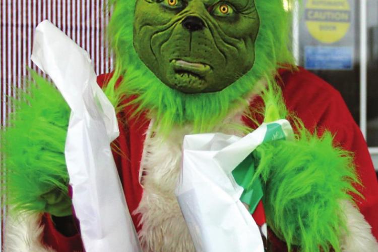 THE GRINCH is aided by Sharon Donat from The Richmond News and Excelsior Springs Standard.