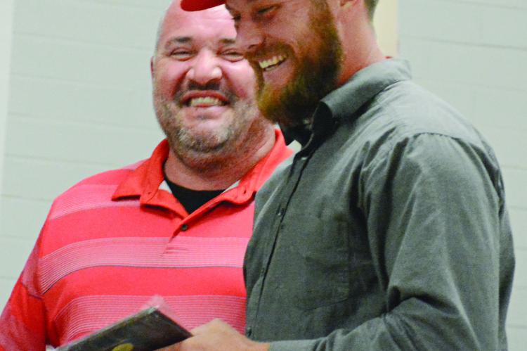 BRANDON QUICK (left) and Cody Gorham share a moment of joy during the Richmond Spartan Athletic Hall of Fame induction ceremony. SHAWN RONEY | Staff