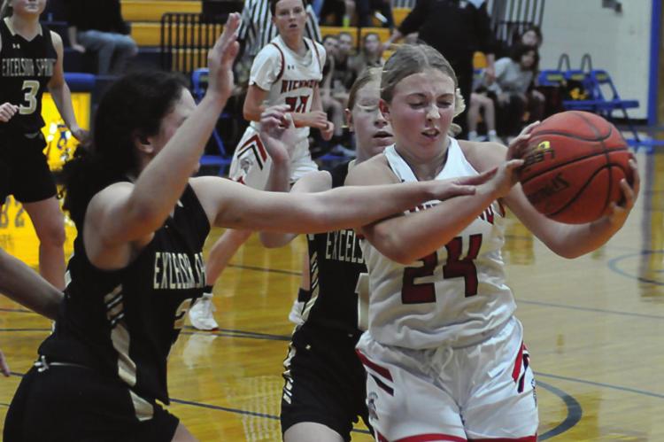 SOPHOMORE Laney Moyer snags a fourth-quarter rebound as the Spartans take Excelsior Springs to the wire Dec. 10 at the Husker Classic. SHAWN RONEY | Staff