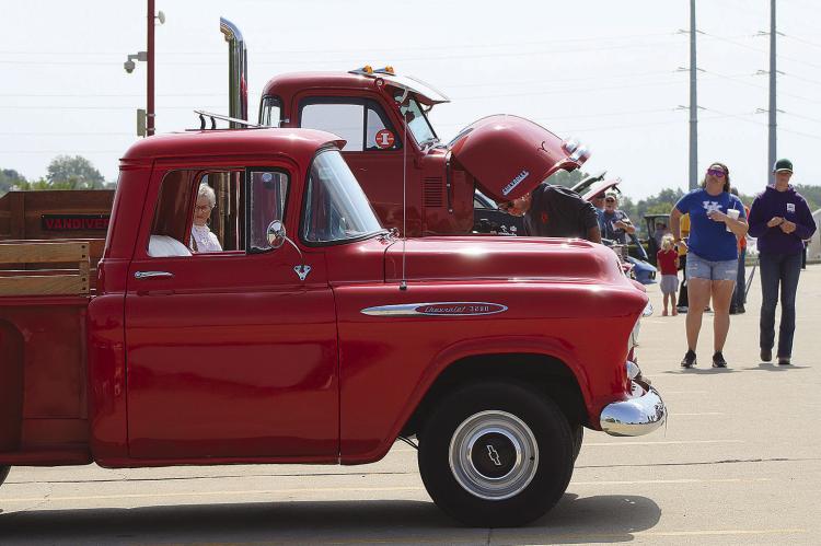 COMMUNITY MEMBERS gather during the Spartan Spectacular Auto Show to raise money and view vintage vehicles. SHARON DONAT | Staff