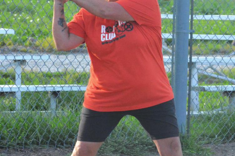 HARDIN-CENTRAL varsity softball coach Brandee Doyle drills her Bulldogs on their fielding by hitting them some grounders Monday morning at the Hardin American Legion and Auxiliary baseball and softball fields. SHAWN RONEY | Staff