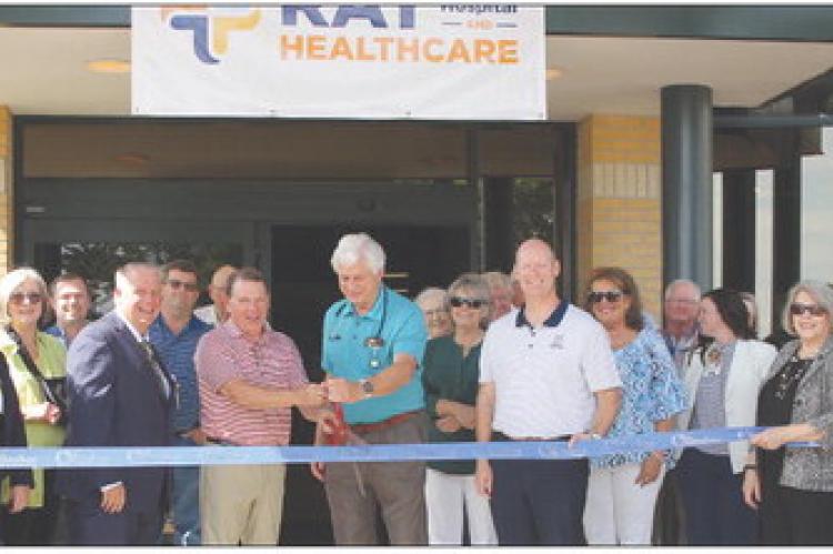 The Richmond community show’s support as Representative Sam Graves (left) and Dr. Mark Rose cut the chamber ribbon. SOPHIA BALES | Staff